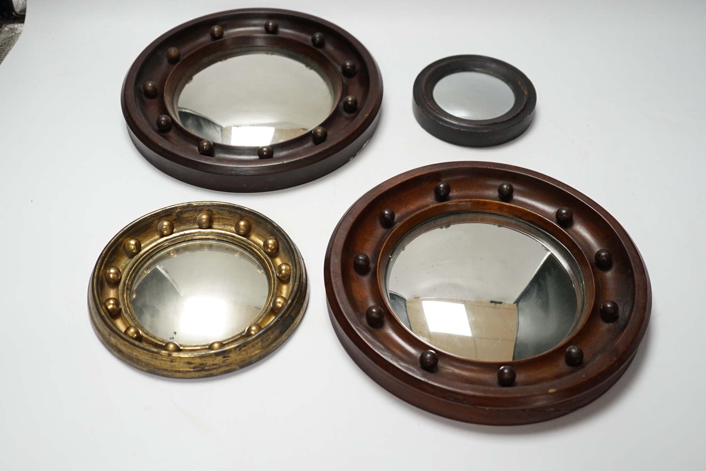 A pair and two other small convex wall mirrors, largest 23cm